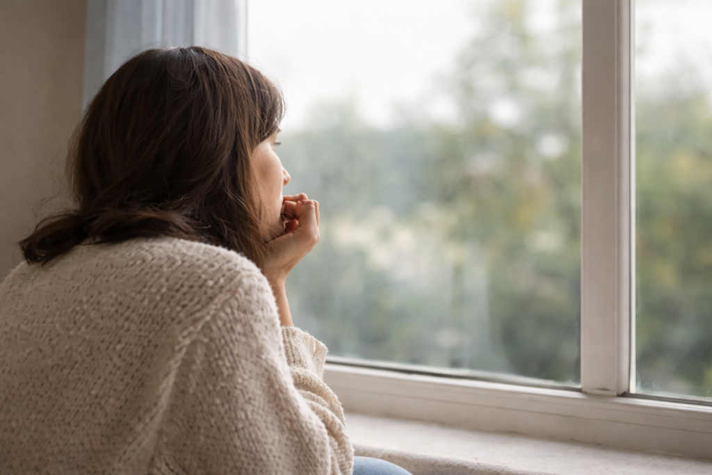 Contemplative moment by the window